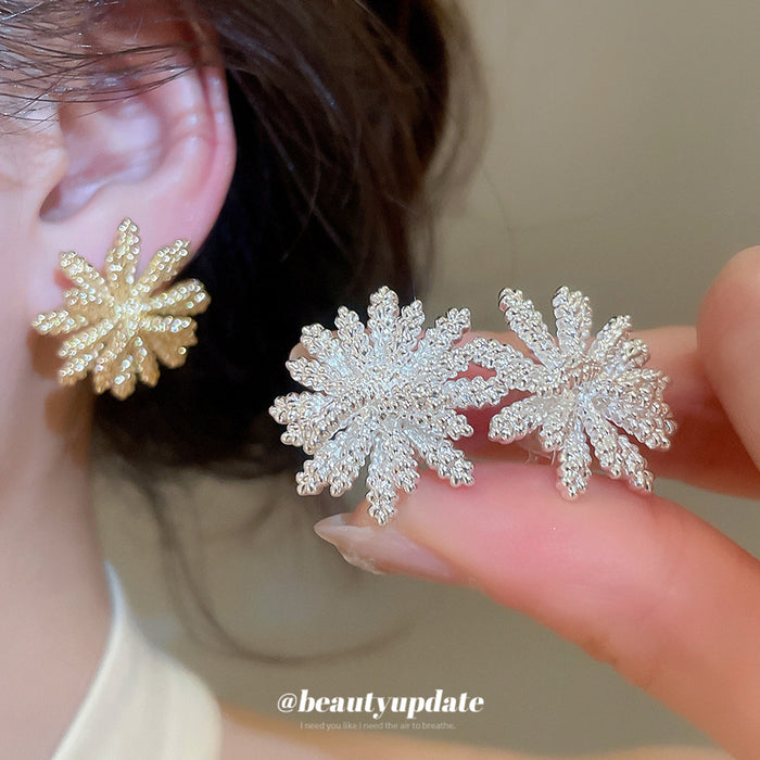 Radiating Textured Flower Clip On Earrings In Two Tones