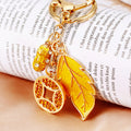 Yellow Leaf and Coin Charm Keychains with Fifteen Braided Strap Options view 1