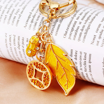 Yellow Leaf and Coin Charm Keychains with Fifteen Braided Strap Options