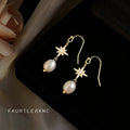 Gold Tone Eight Point Star And White Pearl Hook Earrings view 3