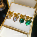 Gold Tone Crossed Bar and Cube Drop Earrings in Two Colors view 3