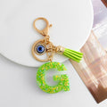 Green Glitter Letter Keychain with Evil Eye Charm and Suede Tassel view 9