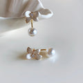 White Flower and Pearl Drop Stud Earrings with Metal Settings view 3