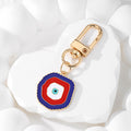 Red and Blue Evil Eye Keychains Necklaces and Earrings in Two Shapes view 7