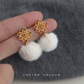 Gold Openwork Flower Black Zircon White Pom-Pom Drop Earrings view 1