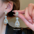Crystal Teardrop Statement Earrings in Gold and Silver Tones view 4