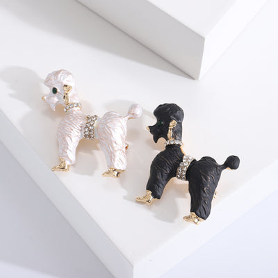 Product display showing a standing poodle with textured enamel fur and gold-tone details