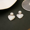 Ribbed Heart Gold and Silver Statement Stud Earrings view 7