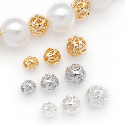 Front overview of openwork mesh ball metal spacer beads arranged by finish and size