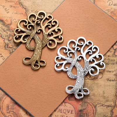 Scroll Branch Tree of Life Metal Charm shown in grouped finish view