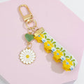 Floral Fabric Strap Keychain With Enamel Daisy And Heart Charms view 3
