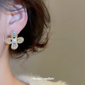 Gold Tone Crystal Petal Flower Stud Earrings With Pearl Centers view 4