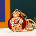 Enamel Double Fish Fortune Pouch Keychains in Six Pictured Color Options view 1
