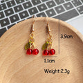 Mini Red Bead Cherry Dangle Earrings Green Leaf Gold Tone view 4