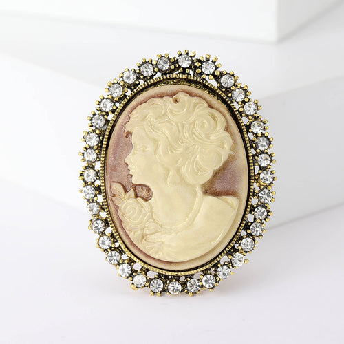 Oval antique gold cameo brooch with cream lady profile and rhinestone rim