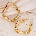 Twisted Cutout Hoop Earrings in Gold-Tone Metal Jewelry view 3