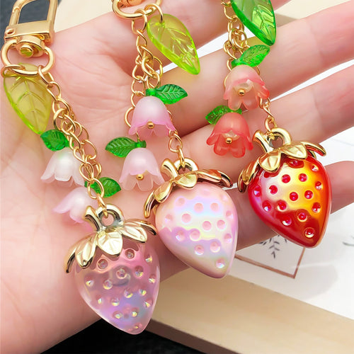 Alternate arrangement of the red pink and purple strawberry flower metal clasp keychain showing its hardware and charm d