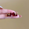 Small Flocked Horse Stud Earrings In Black And Burgundy view 7