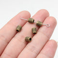 Dotted Barrel Spacer Beads in Three Antique Metal Finishes view 5