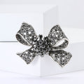 Dark Crystal Bow Brooch With Textured Ribbon Loops view 1