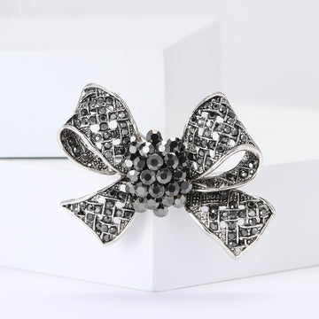 Dark Crystal Bow Brooch With Textured Ribbon Loops