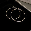 Minimal Thin Round Hoop Earrings in Gold and Silver view 6
