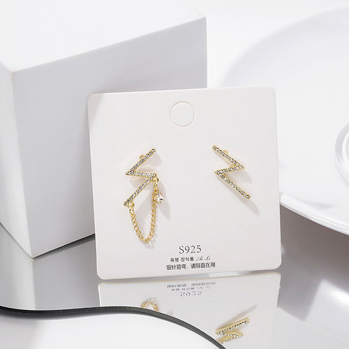 Gold lightning bolt studs on white card marked S925