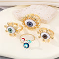 Gold Tone Realistic Eyeball Adjustable Rings and Three-Eye Cuff Bracelet view 1