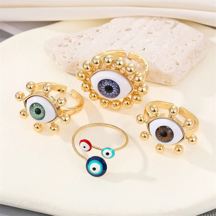 Gold Tone Realistic Eyeball Adjustable Rings and Three-Eye Cuff Bracelet
