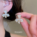 Gold And Silver Floral Stud Earrings In Three Sculpted Designs view 4