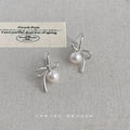 Silver Metal Ribbon Bow White Pearl Drop Earrings Pair view 1