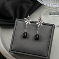 Silver Sculptural Flower Black Teardrop Dangle Earrings view 1