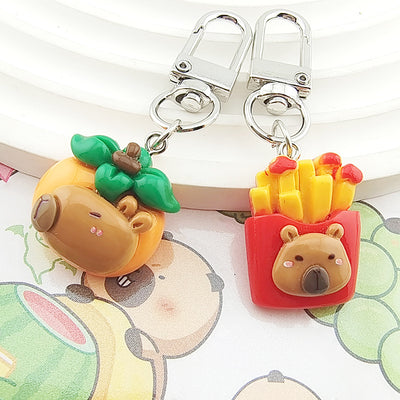 Main product view of silver Tone Capybara Food Figure Clip Keychains in Four Designs