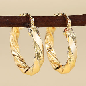Faceted Twist Hoop Earrings in Gold-Tone Metal Jewelry
