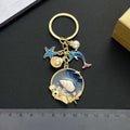 Blue Dolphin Starfish Shell and Faux Pearl Ocean Charm Keychain view 3