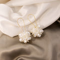 White Translucent Petal Ball Gold Tone Hook Earrings view 3