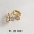 Pavé CZ Bow Huggie Hoop Earrings Gold and Silver Tones view 6