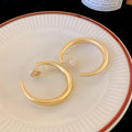 Rounded Hoop Clip Earrings in Gold and Silver Tone view 7
