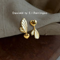 Gold-Tone Asymmetric Heart White Enamel Wing Earrings view 4