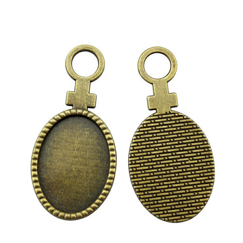 Gender Symbol Oval Cabochon Pendant Trays in Two Finishes shown in image 2 with gender-symbol top loops