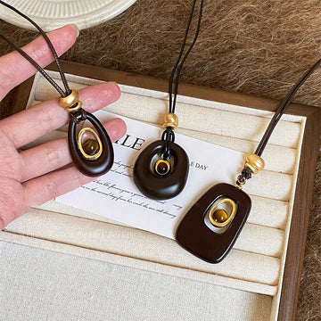 Brown Oval Resin Pendant Cord Necklace with Distinctive Textured Details