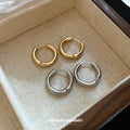 Polished Round Huggie Earrings in Silver Tone and Gold Tone view 1