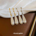 White Teardrop Dangle Earrings In Gold And Silver With Decorative Details view 4