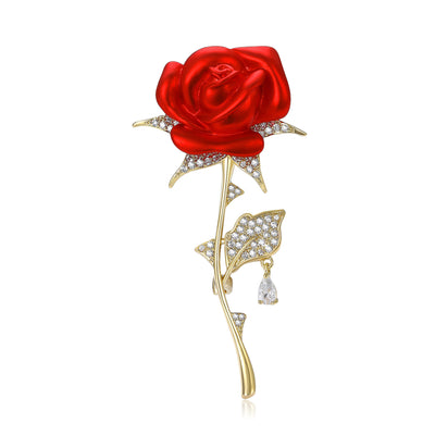 Front view of red rose stem brooch with clear crystal leaves decorative metal pin