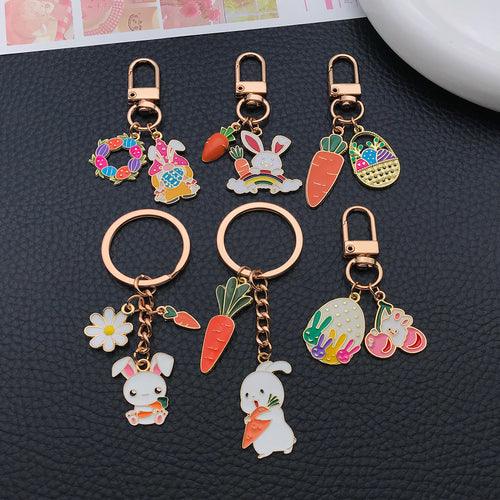 Styled close-up of easter bunny egg wreath and carrot keychain showing colors and surface details