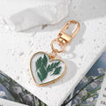 Gold Tone Heart Pressed Botanical Resin Clip Keychains view 5