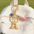 Gold Tone Initial Letter Keychain with Evil Eye and Pink Tassel view 4