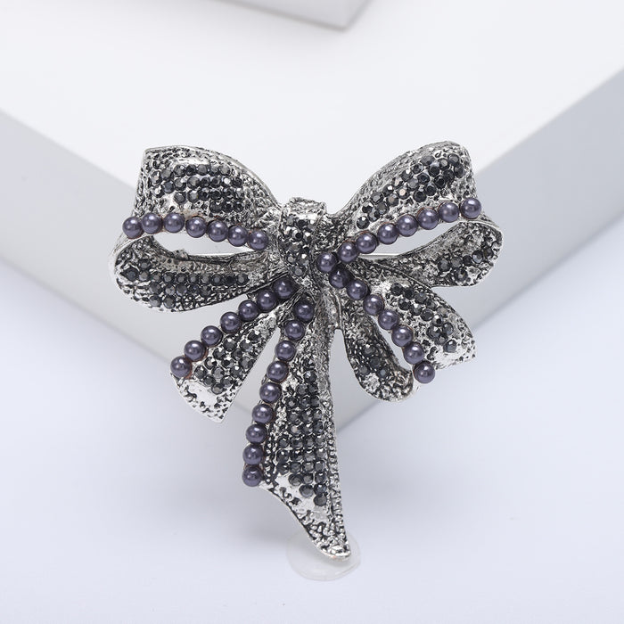 Large Crystal Bow Brooch With Pearl Rows in Three Finishes