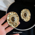 Textured Gold Tone Oval Stud Earrings With Brown Centers view 3