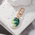 Gold Tone Oval Marbled Swirl Enamel Clip Keychains in Six Colors view 5